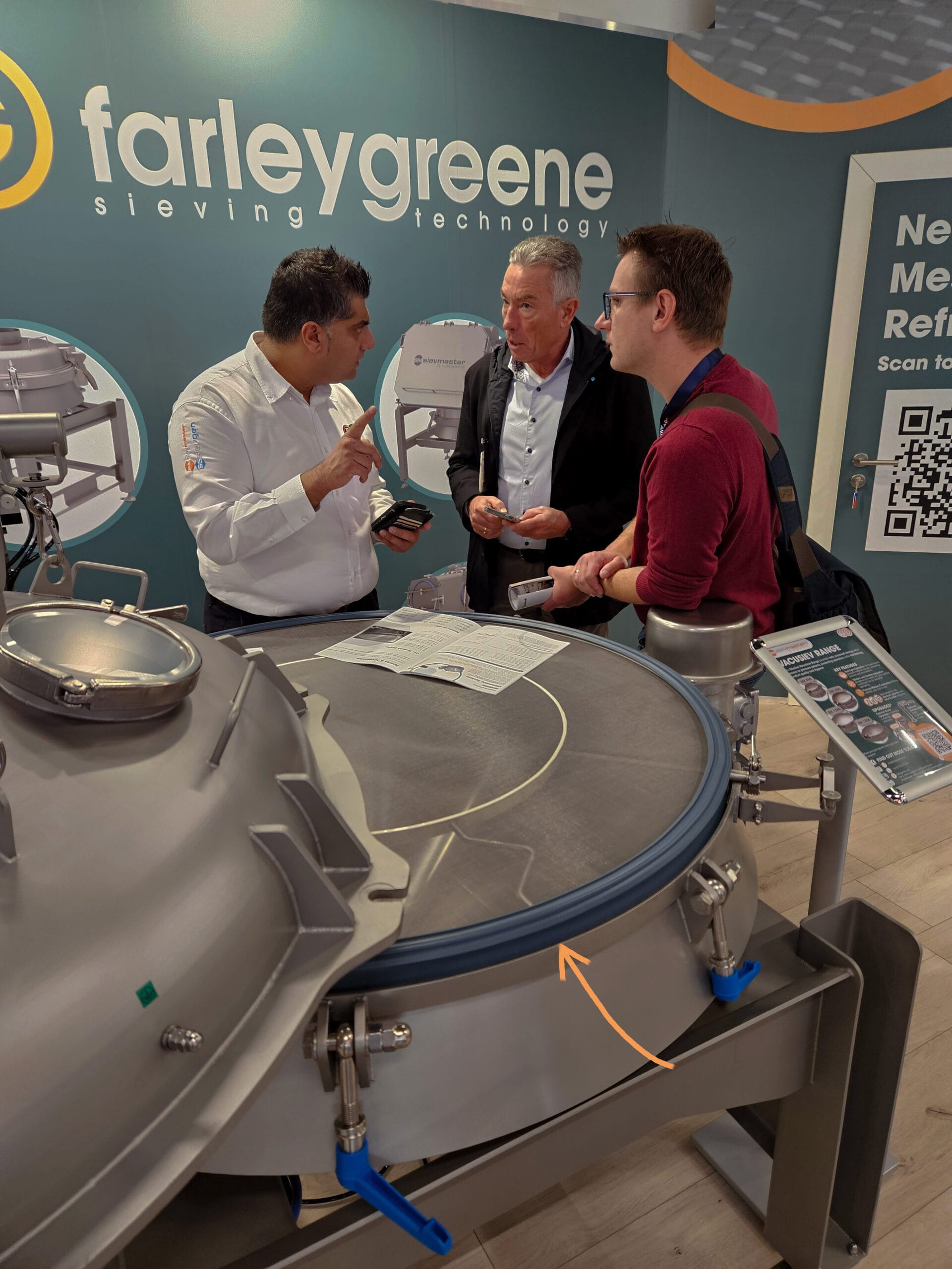 Rehan Tariq discussing gaskets and sieve mesh aperture with visitors at the Farleygreene POWTECH 2025 exhibition stand